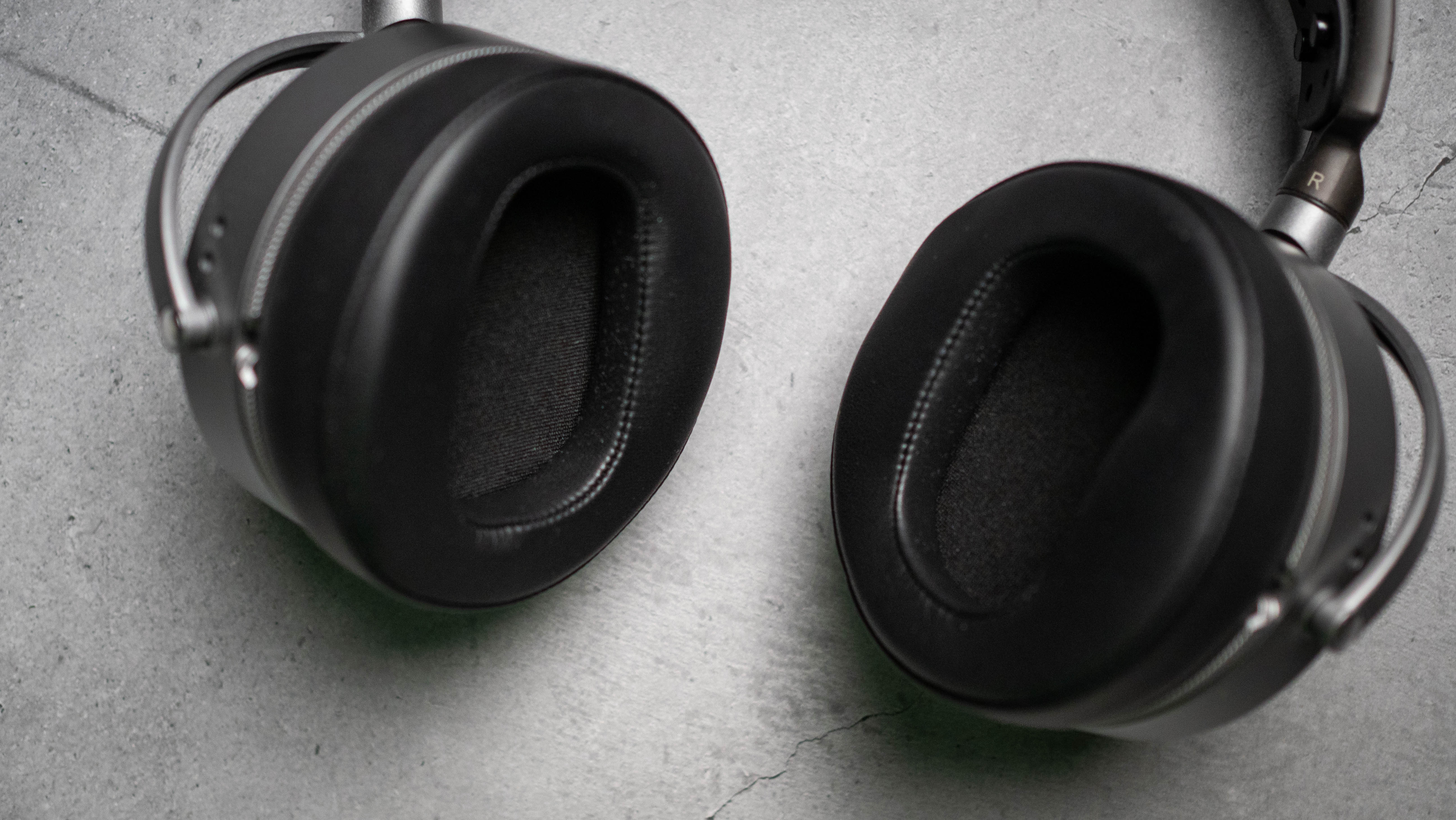 Audeze LCD-S20 planar headset in front of gray kraft sheet highlighting product design