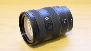 Sony E 16-55mm f/2.8 G on a wooden surface