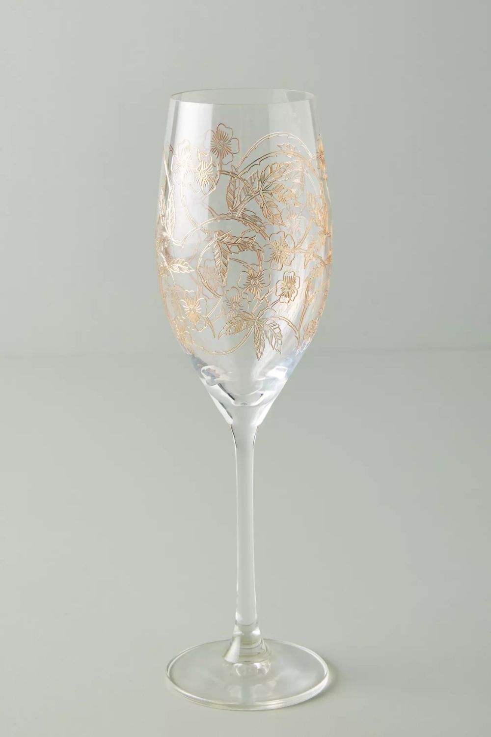 Wine glass with etched gold floral design