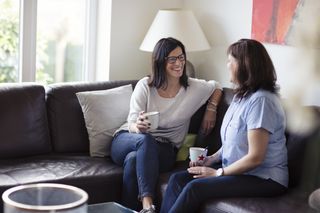 Two women meeting up indoors as the rules change on how many people can meet up indoors and outside