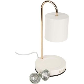 A white candle warmer lamp
