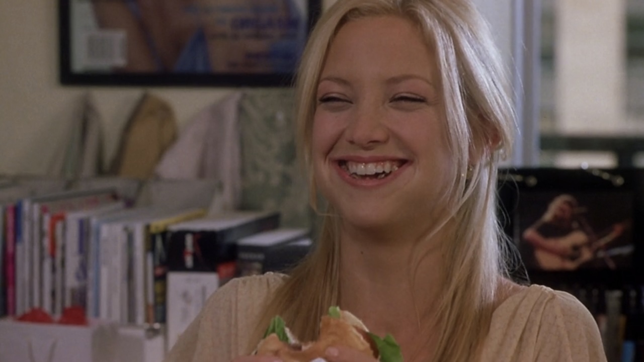 Kate Hudson laughing with a burger in How To Lose A Guy In 10 Days
