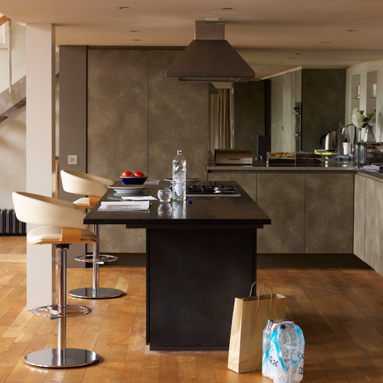 kitchen room with wooden flooring and grey kitchen chimney