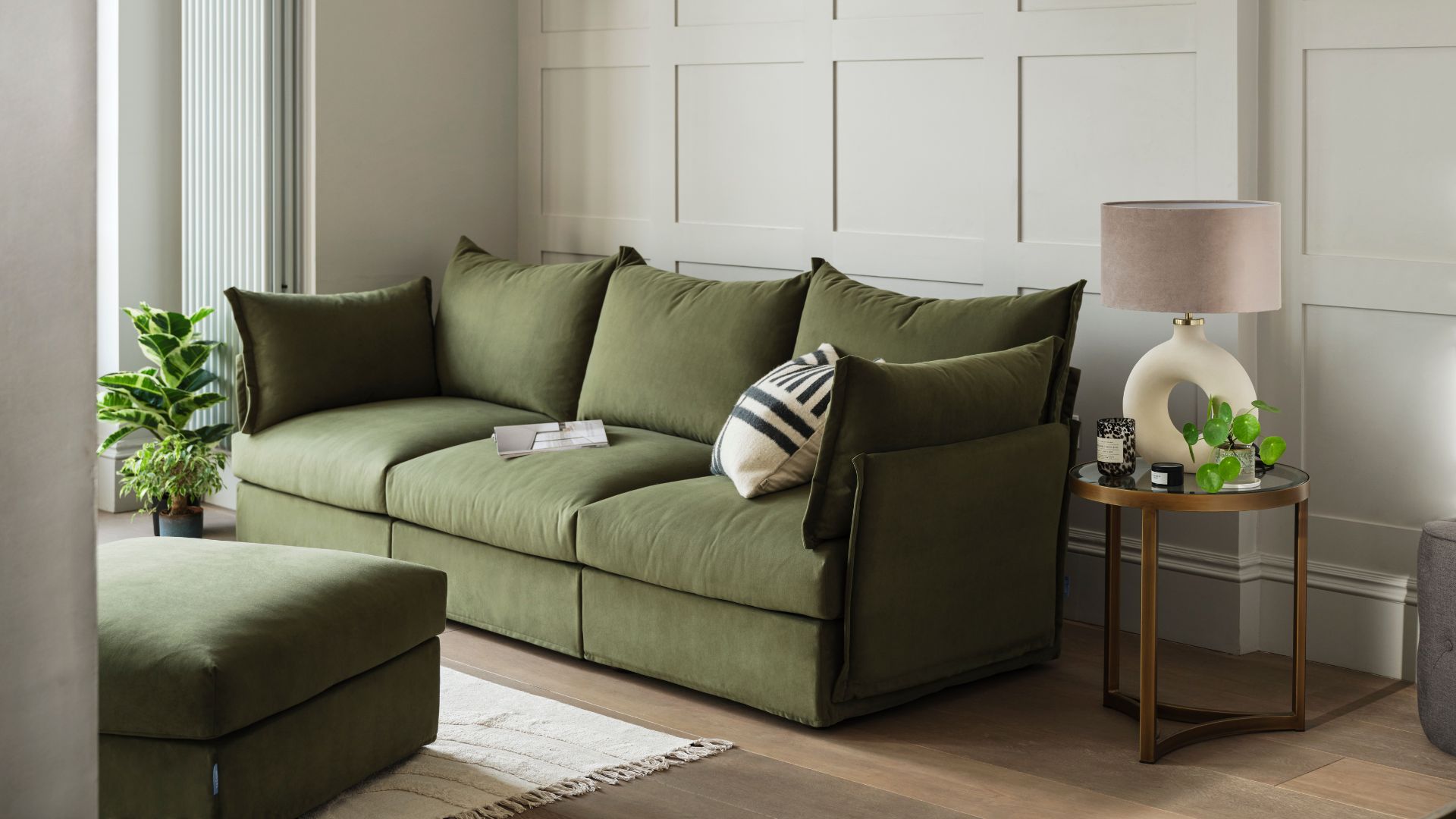 picture of forest green three seater sofa in living room