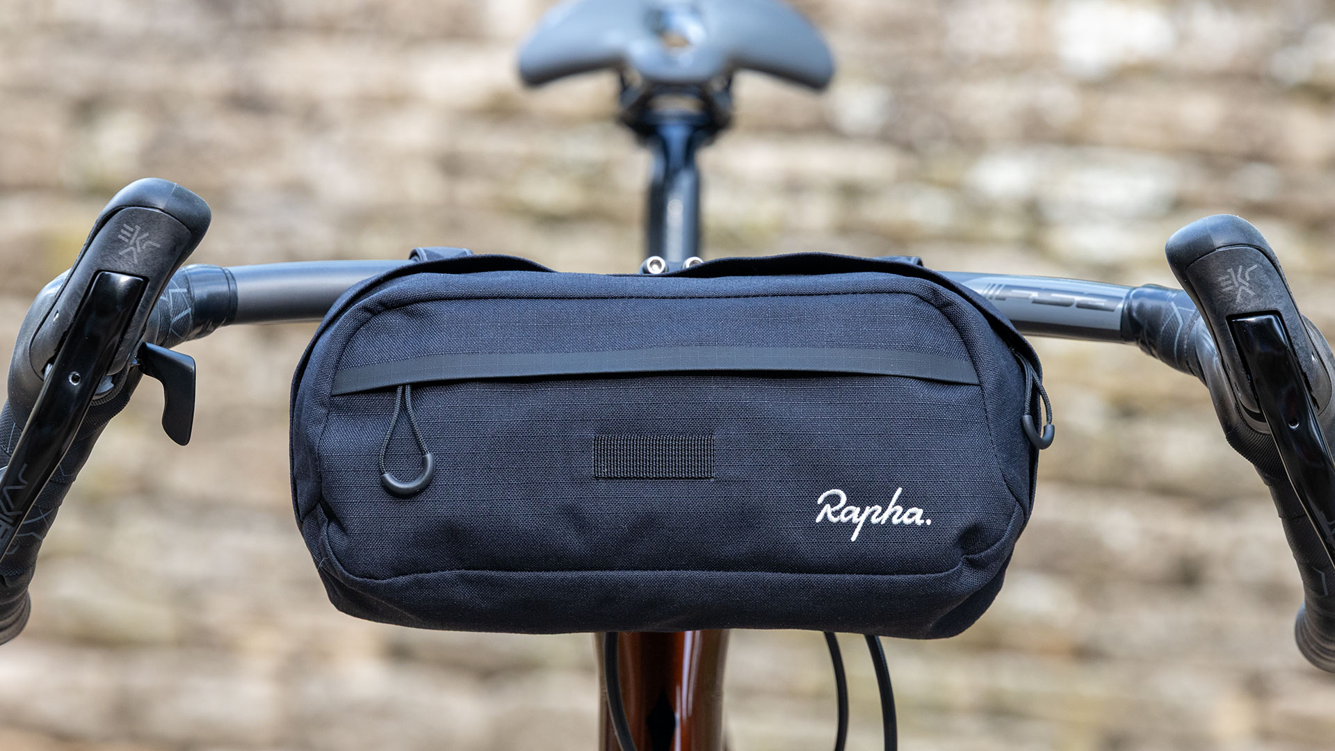 Rapha Explore Bar Bag pictured from the front, mounted on bike