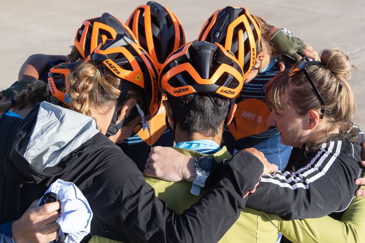Members of the Amy D Foundation composite team huddle with DS Julie Kuliecza