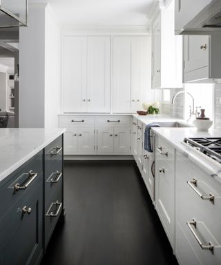 Small white kitchen ideas with white units around the perimeter and a dark grey island