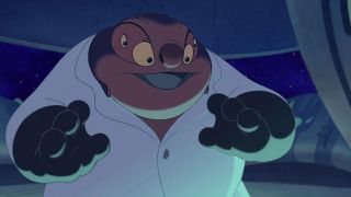 Still from the animated movie Lilo & Stitch (2002). Dr. Jumba Jookiba is a heavy-set, purple alien with four eyes. He is wearing a white lab coat and black gloves.