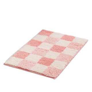 A pink checked bath mat