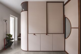 large built in wardrobe with curved edge