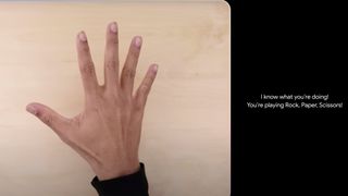 A hand above as table being described by Google Gemini AI