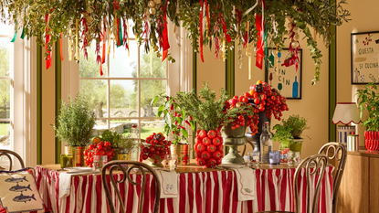 Next x Lia Gold collection tablescape with red striped covering and tomato decor