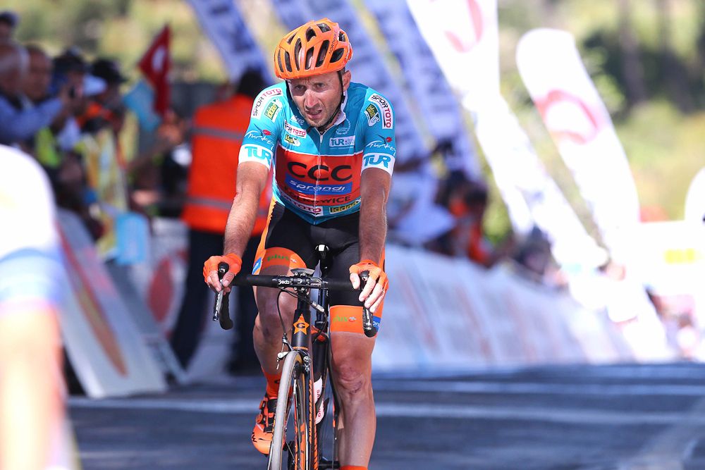 Rebellin crosses the finish line.
