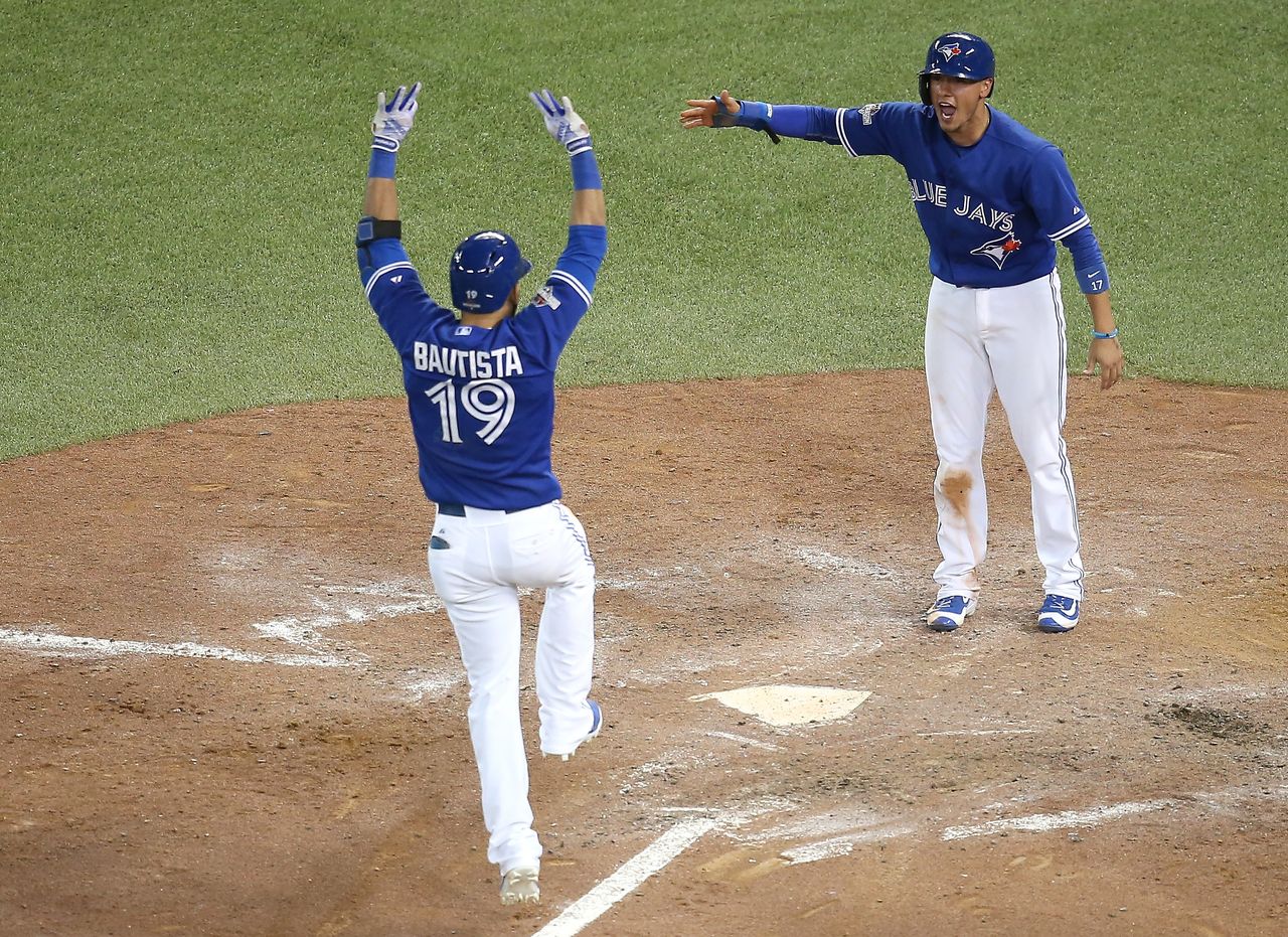 Joe Bautista celebrates after a home run.