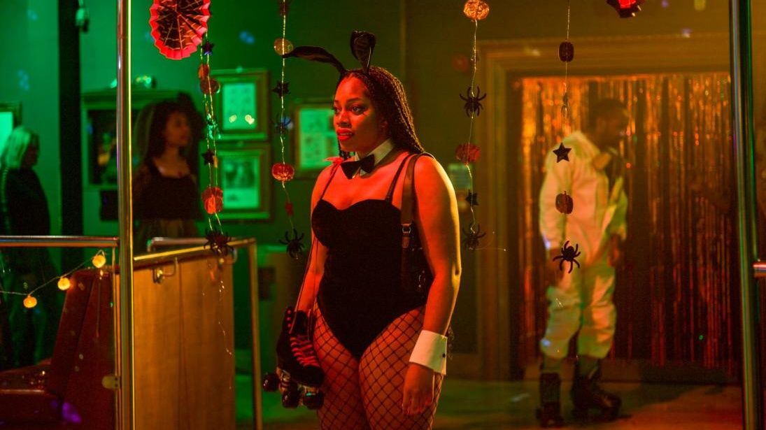 Actor Dionne Brown dressed in a playboy bunny halloween costume in Queenie season 4