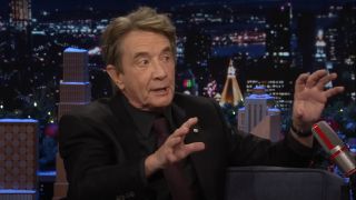 Martin Short gestures with his hands as he speaks on The Tonight Show with Jimmy Fallon.