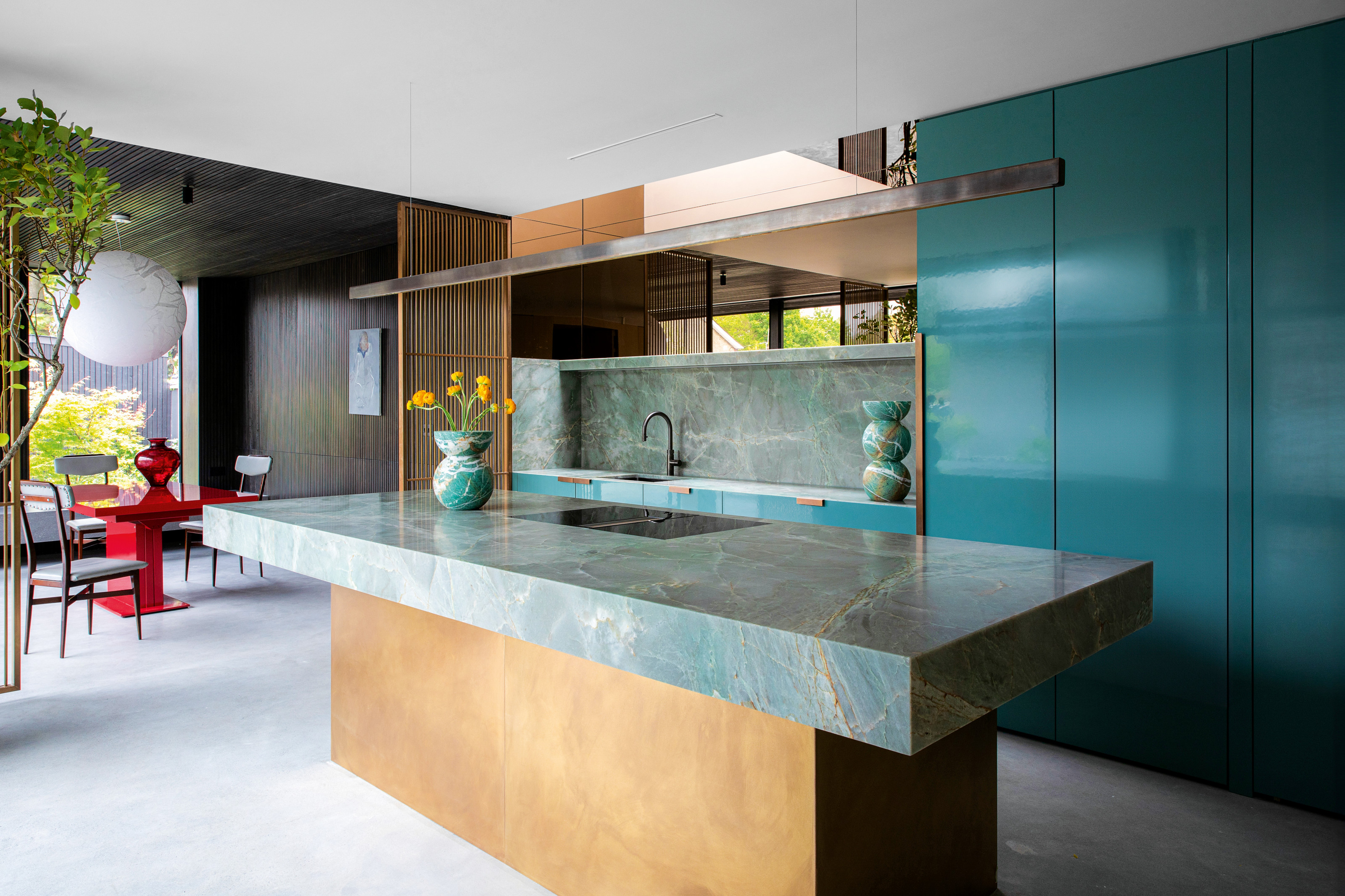 Teal blue kitchen with blue marble topped island