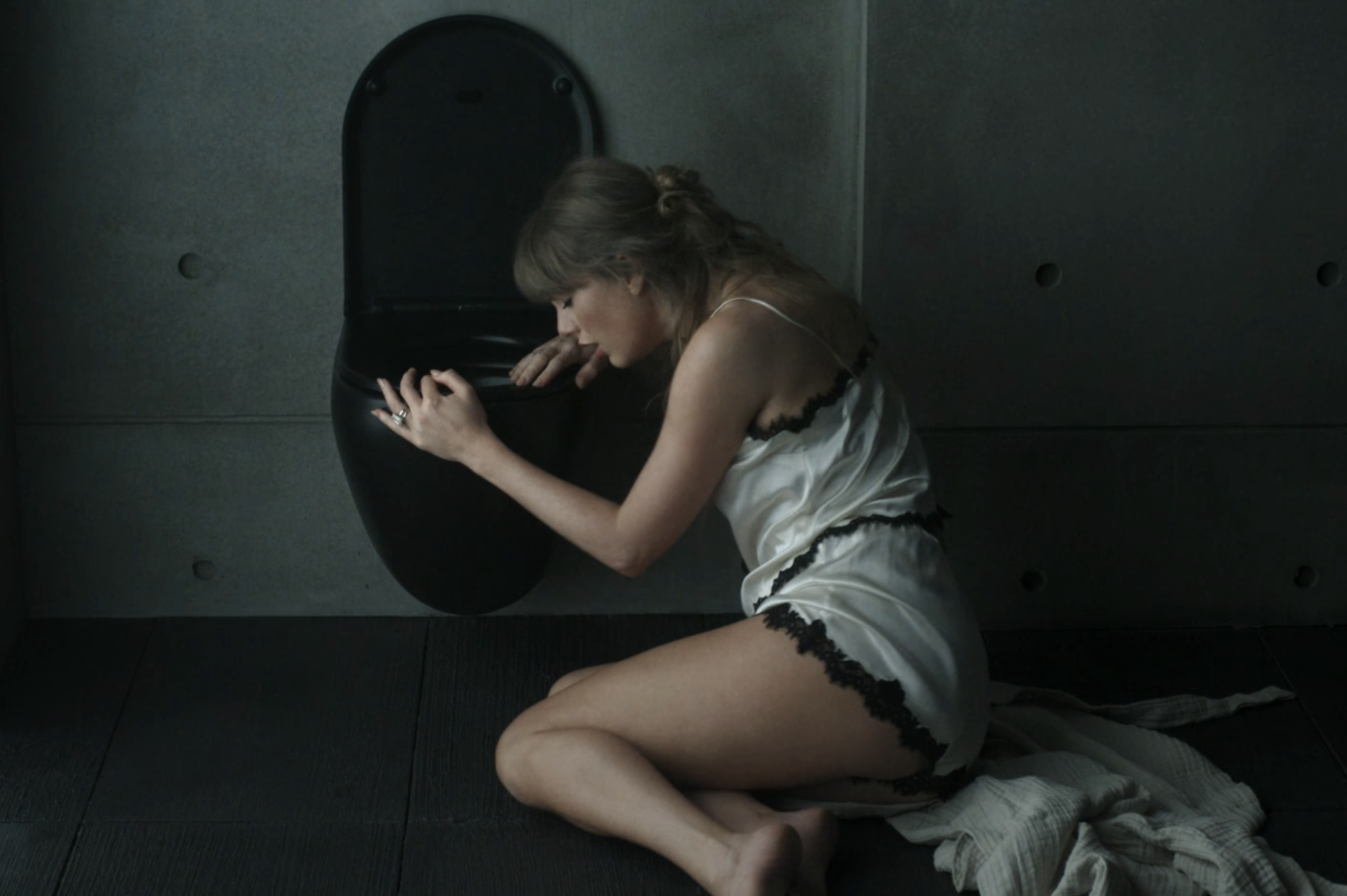 Taylor Swift and Dakota Johnson outfits in the "Patient Zero" music video
