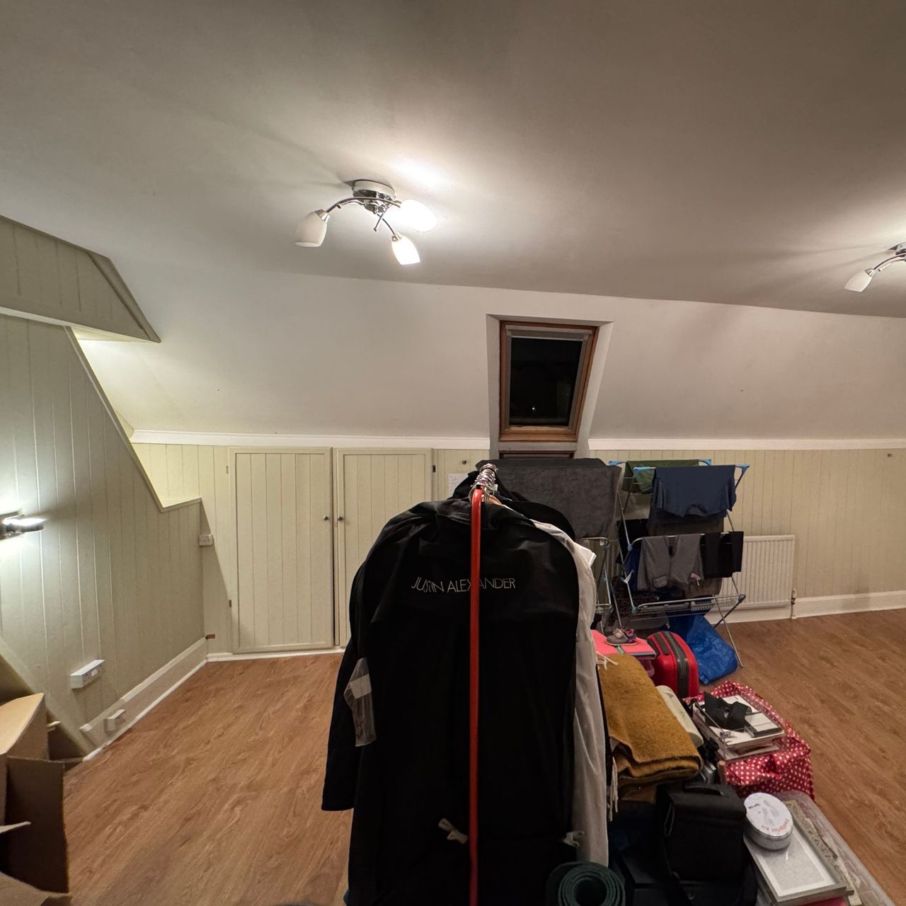 Before photos of loft bedroom used for storage