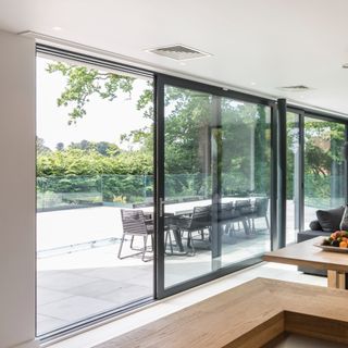 Sliding glass doors on patio with black frame