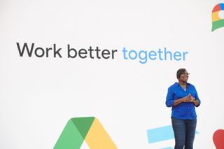 Google I/O 2022: A woman on stage describes Google's "Work Better Together" motto