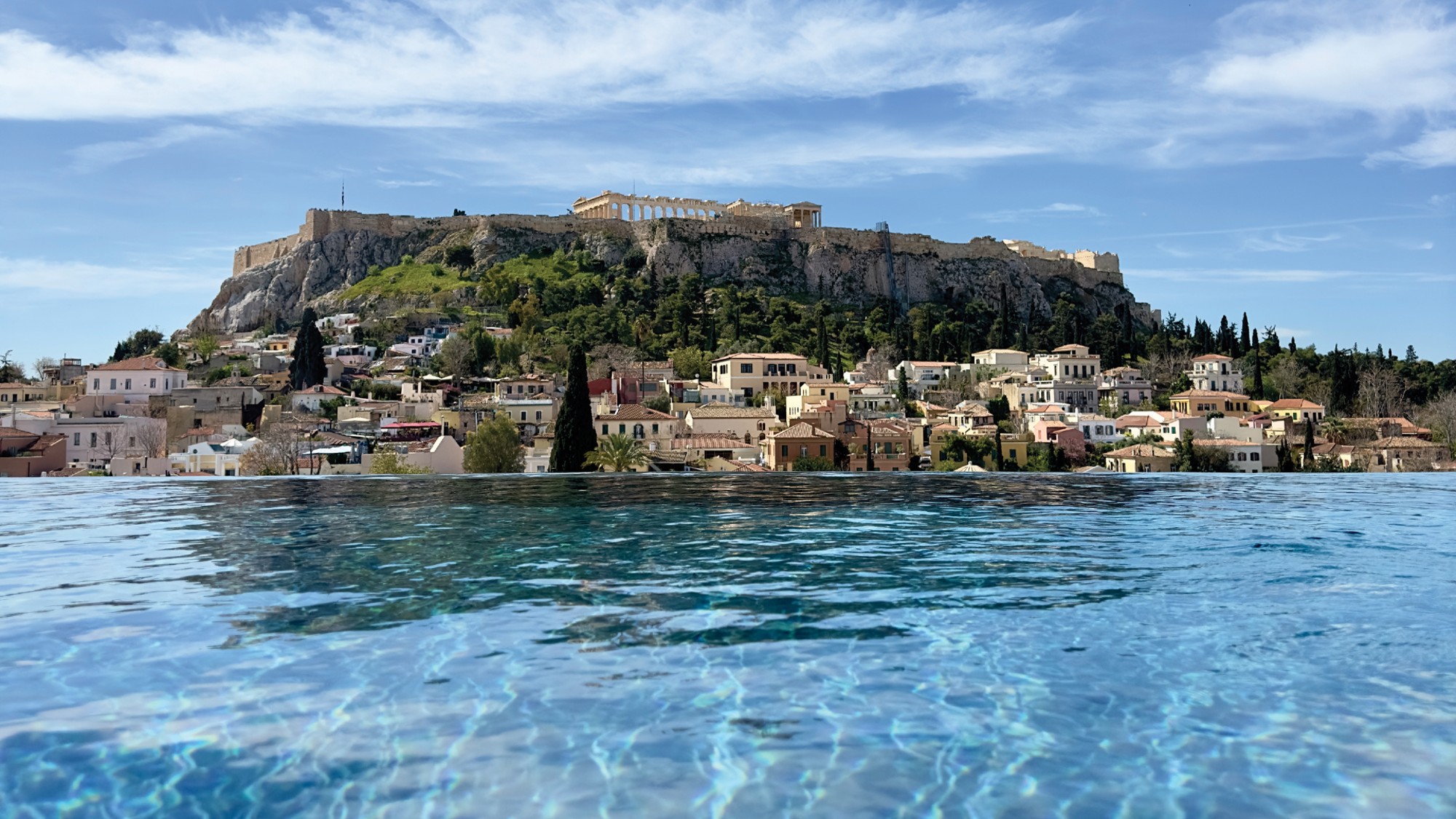 View of the Acropolis from the rooftop infinity pool at the Dolli at Acropolis hotel, Athens