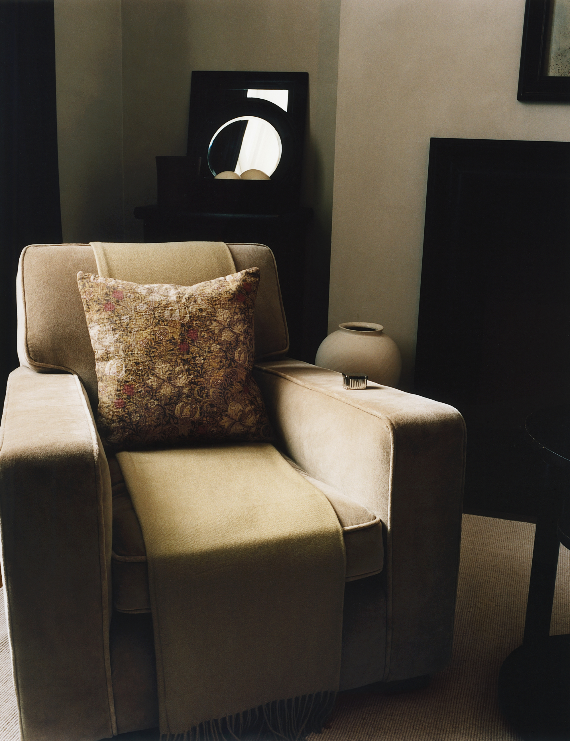 Neutral living room featuring a velvet armchair styled with a floral throw pillow cover from the newly debuted Zara Home x Morris &amp;amp; Co. collection