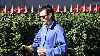 a photo of Harry Styles with EarPods