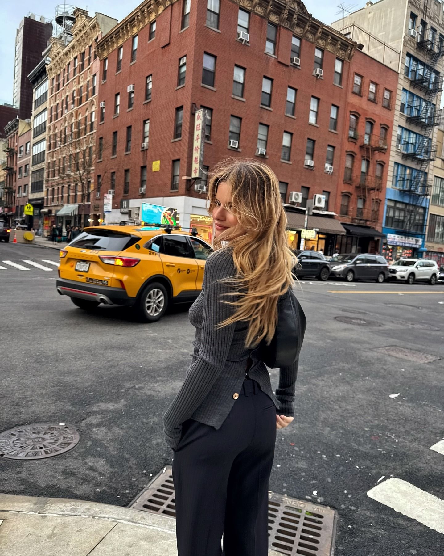 Photo of Sabina Socol in NYC with her hair blowing in the wind