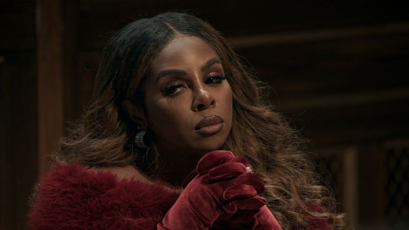 Candiace with her hands crossed at the Traitors round table. 