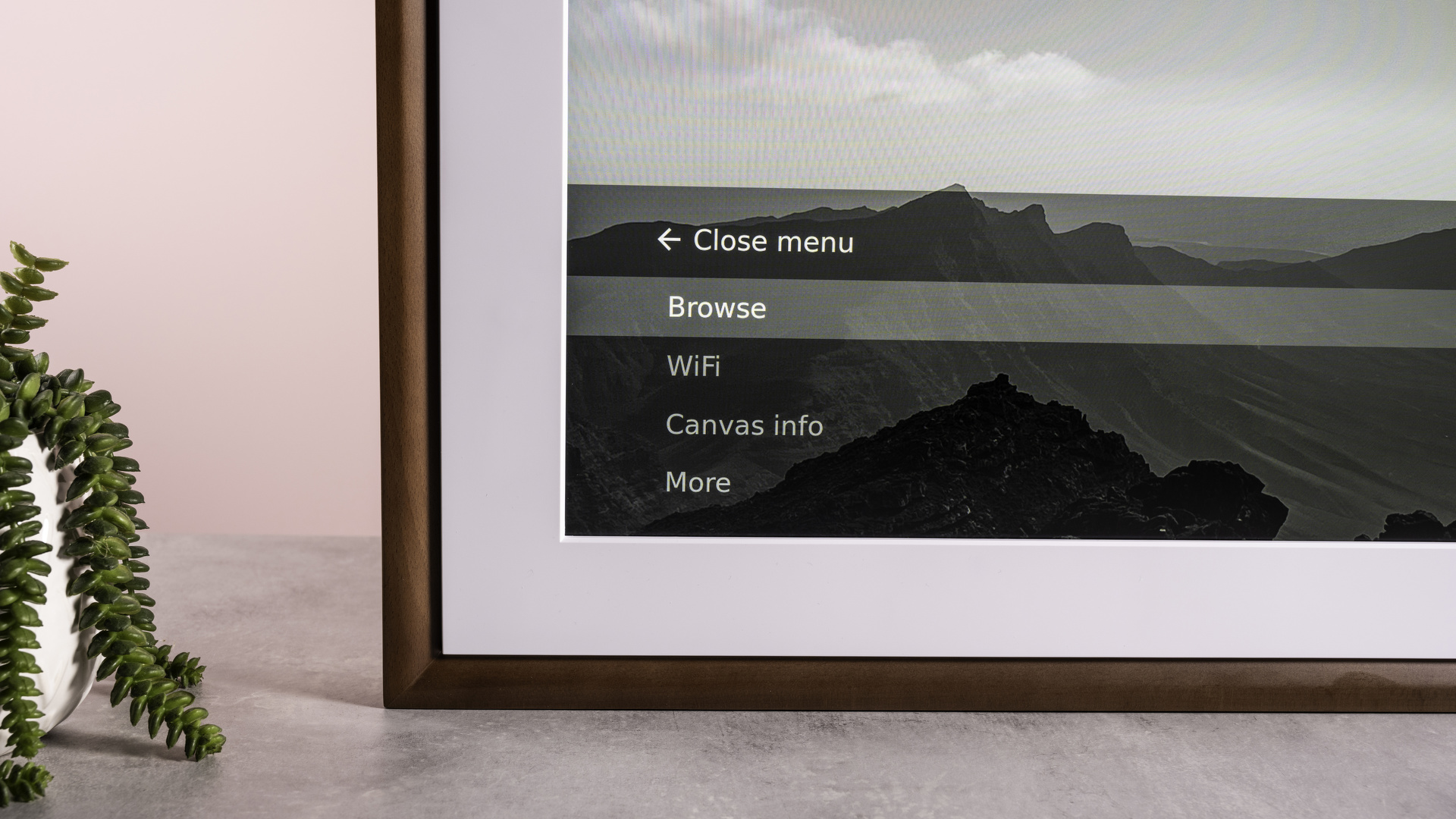 The Netgear Meural Canvas II, showing a closeup of its menu.