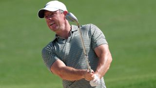 Rory McIlroy plays from a bunker at Yas Links