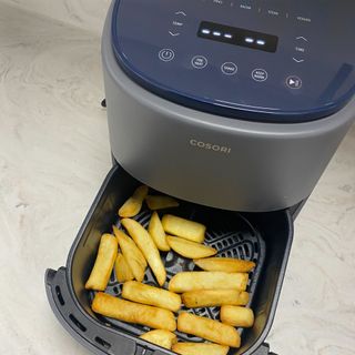 Image of COSORI air fryer with cooked chips