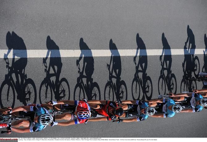 The sun casts along shadow on the Tour of Qatar