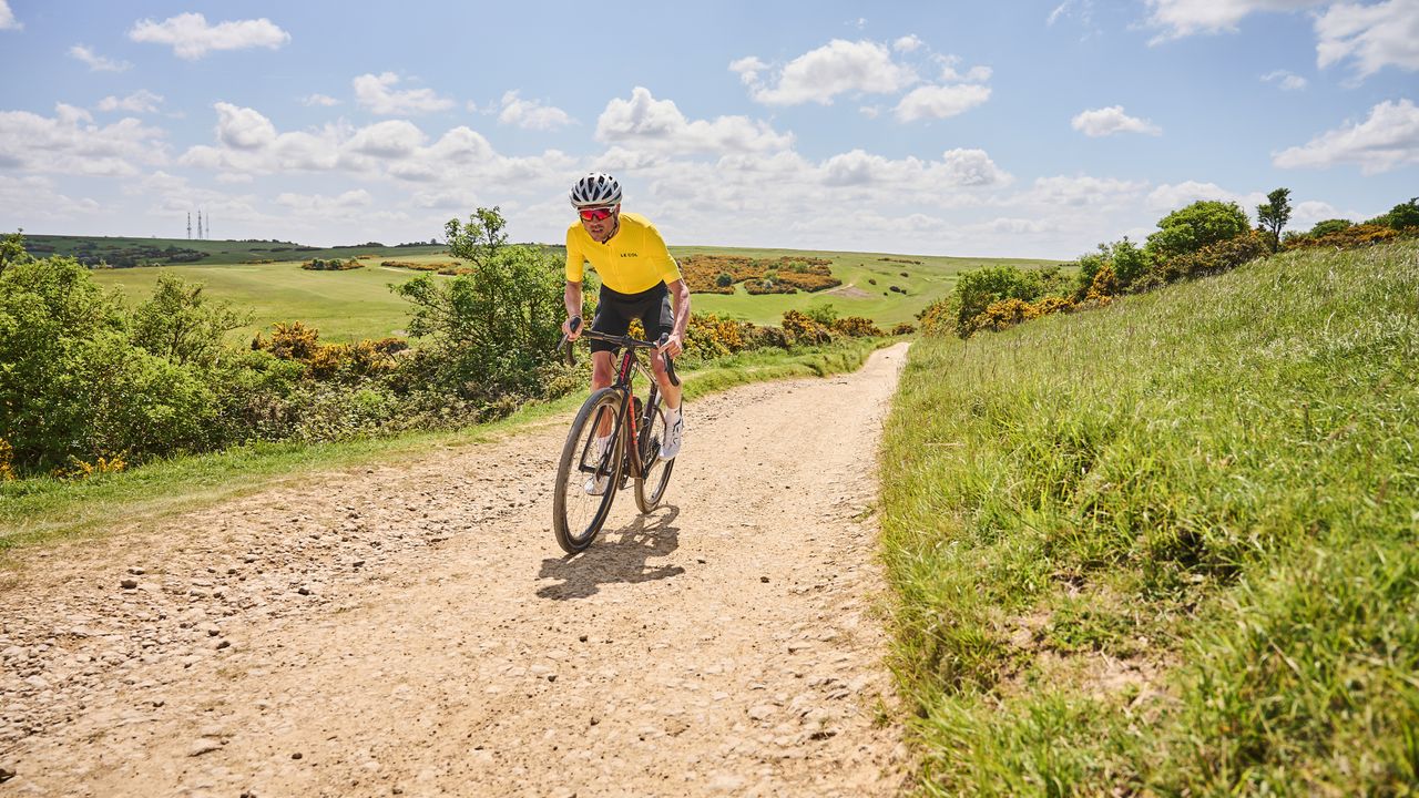 Cyclist riding gravel bike at speed