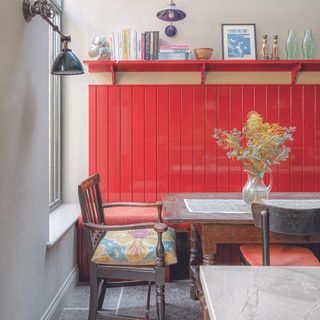 Kitchen with red wall panelling in breakfast nook area