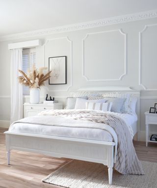 white bed, walls and bedlinen