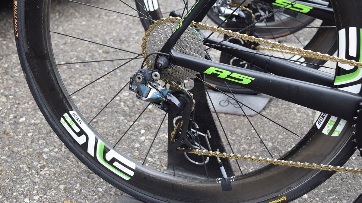 The Dimension Data drivetrains stand out among the peloton with gold KMC chains, Rotor and Shimano components