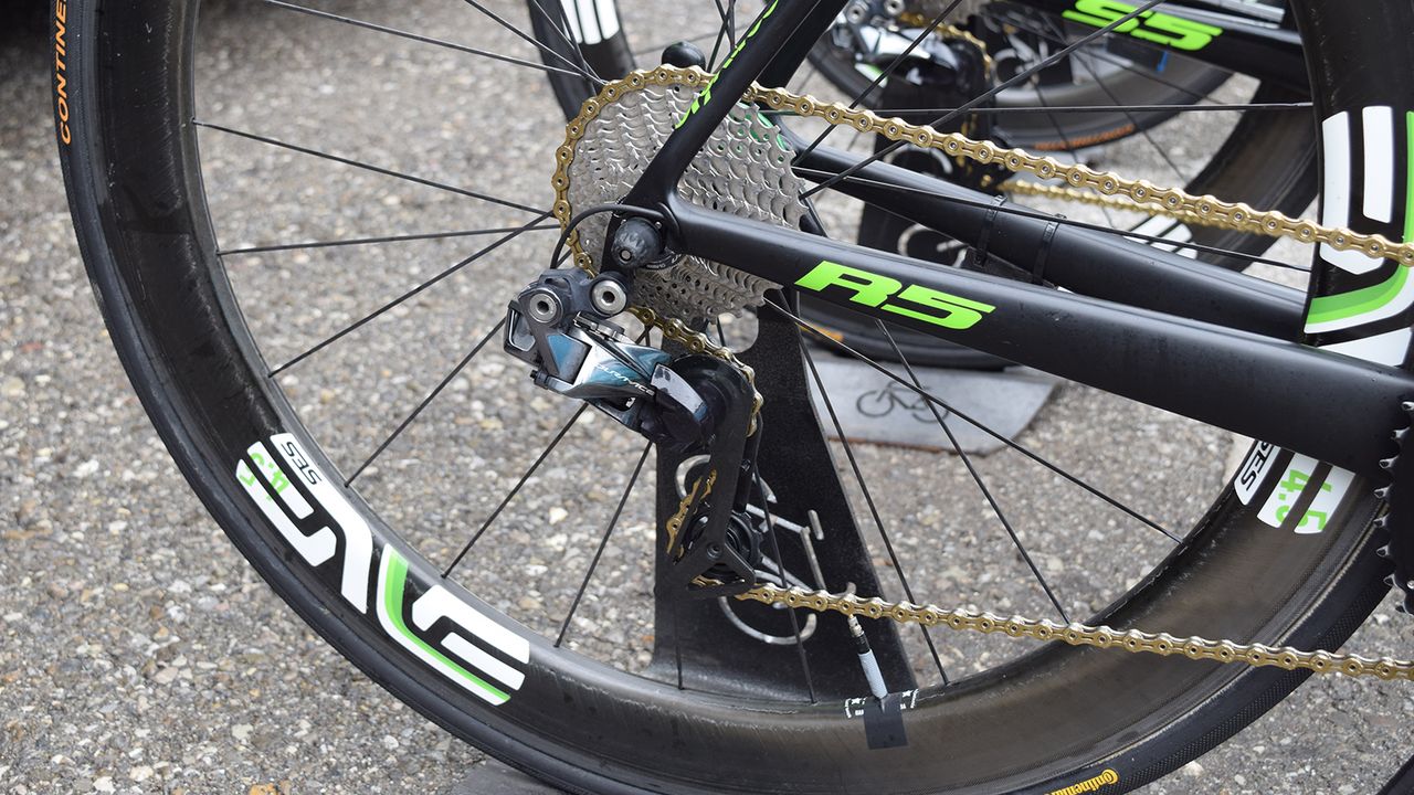 The Dimension Data drivetrains stand out among the peloton with gold KMC chains, Rotor and Shimano components