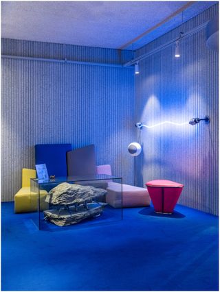 colourful furniture inside blue-lit store