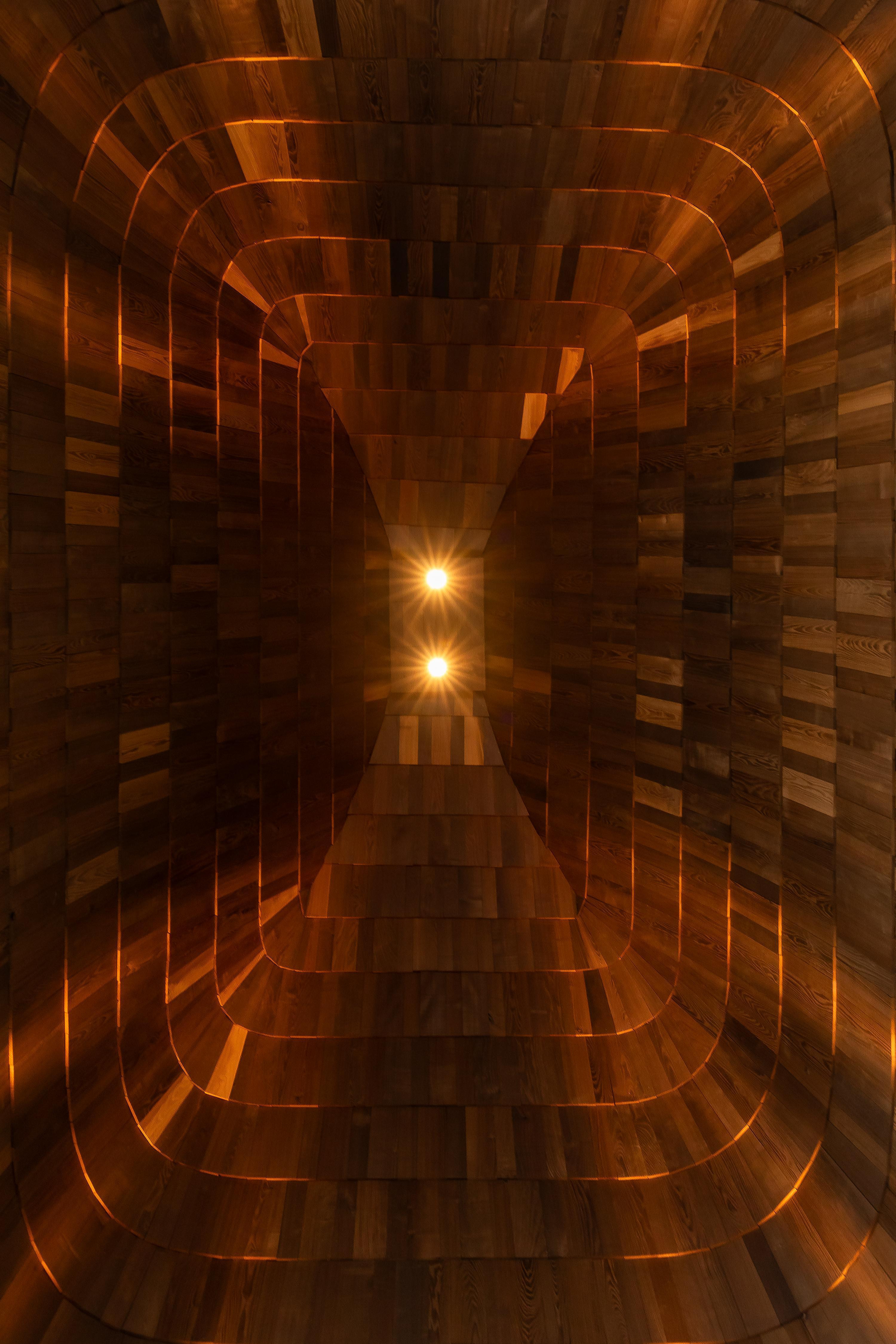 The shingle cladding rises up ten metres into the roof