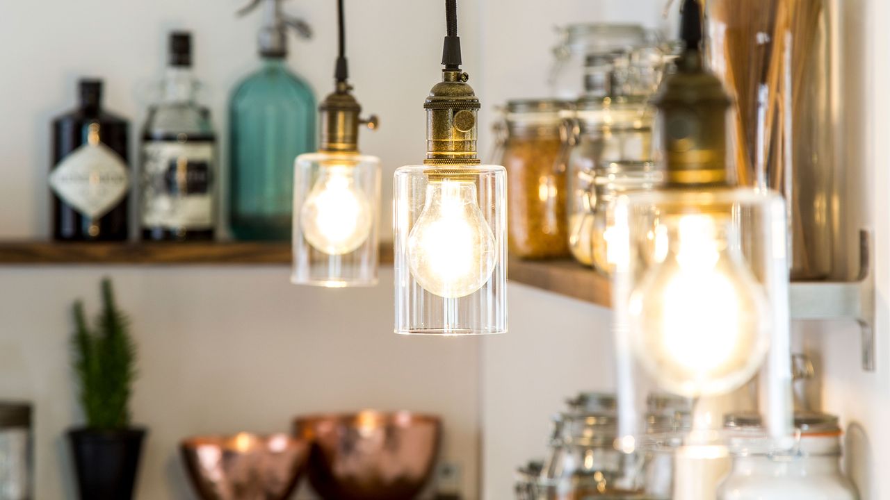 exposed bulbs in kitchen with open shelves