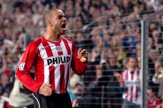 Alex celebrates after scoring for PSV against Lyon in the 2004/05 Champions League quarter-finals