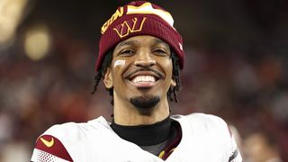 Jayden Daniels #5 of the Washington Commanders smiles after an NFL football wild card playoff game against the Tampa Bay Buccaneers at Raymond James Stadium on January 12, 2025 in Tampa, Florida.