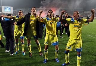 APOEL players celebrate their aggregate win over Lyon in the last 16 of the 2011/12 Champions League