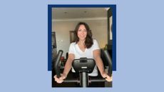 Susan Griffin riding stationary bike in living room