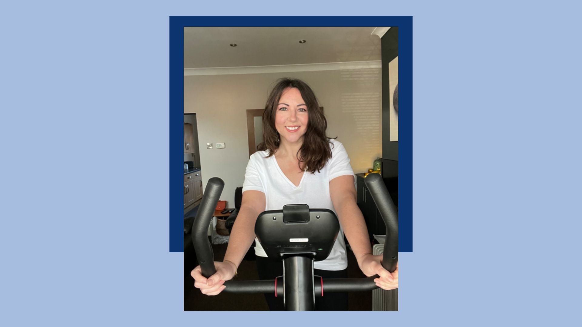 Susan Griffin riding stationary bike in living room