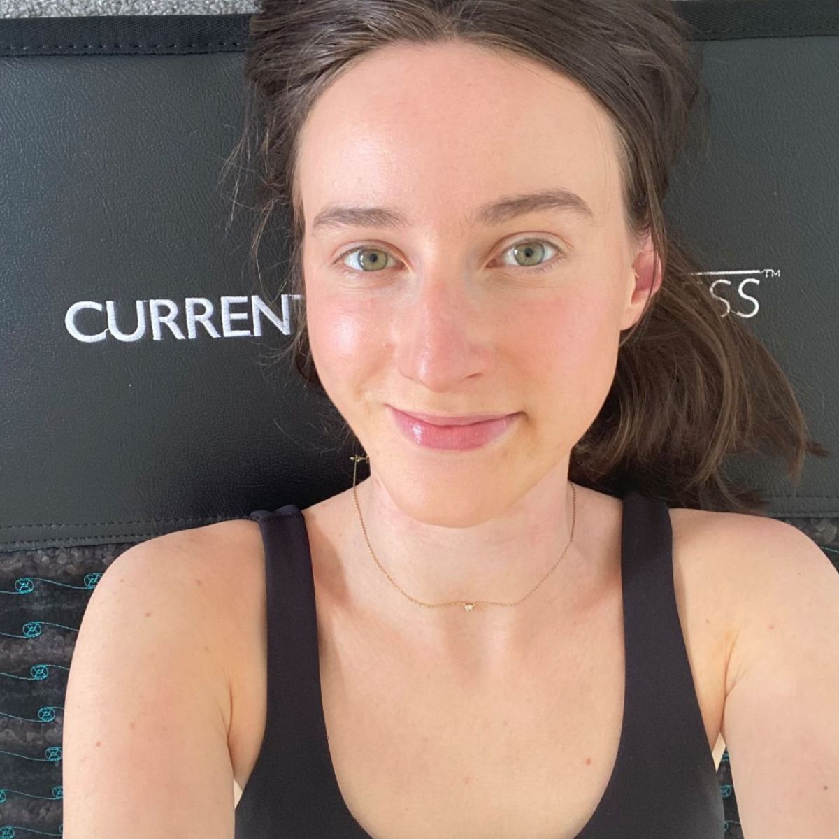 Health writer Katie Sims trying the PEMF infrared mat