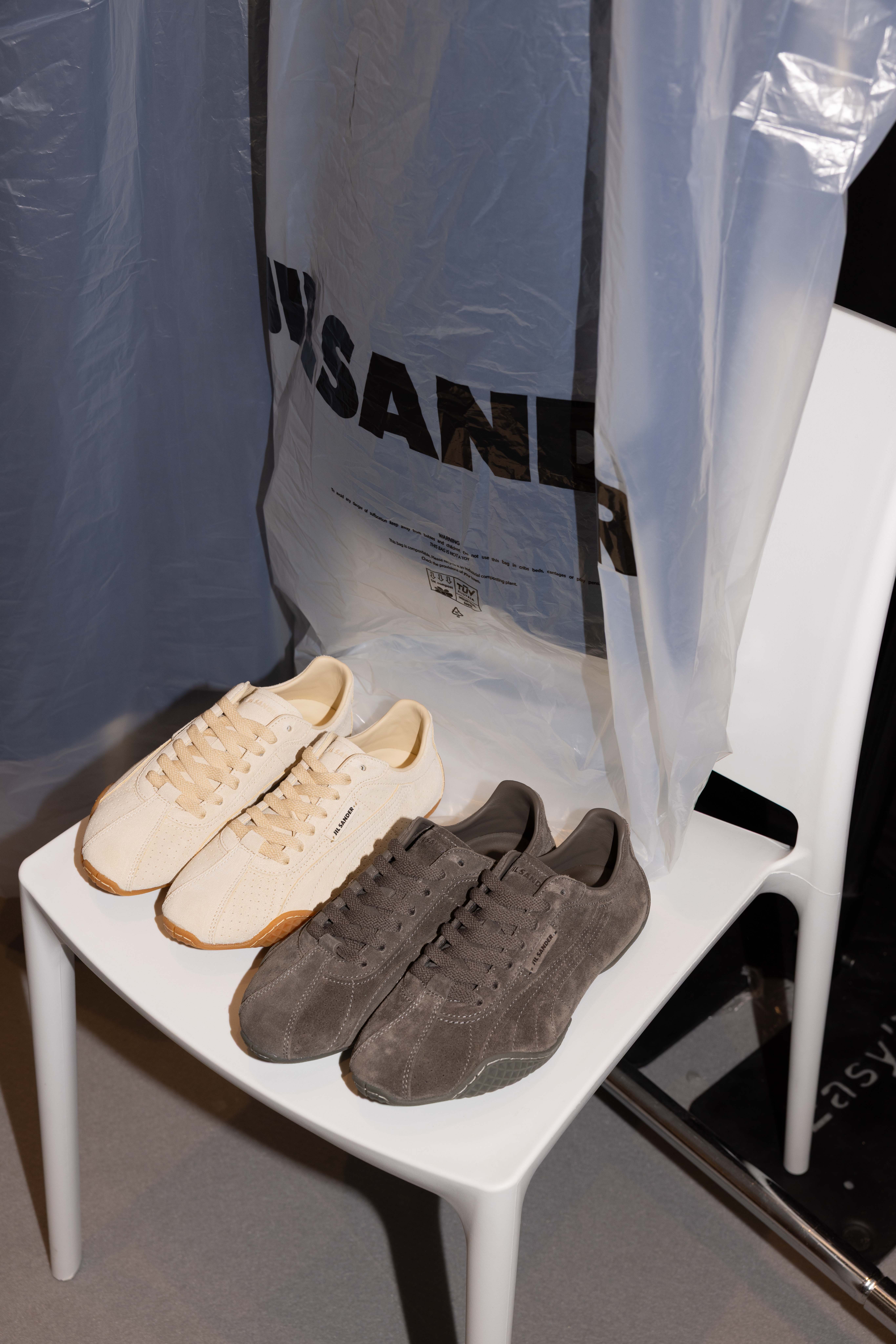 A photo of two pairs of tonal, suede sneakers from the upcoming Jil Sander x PUMA collaboration drop.