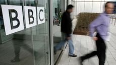 People leave the BBC building, in the corporation's West London headquarters, 21 March 2005. The BBC is to axe 2050 jobs in a second wave of cuts to save hundreds of millions of pounds, the c